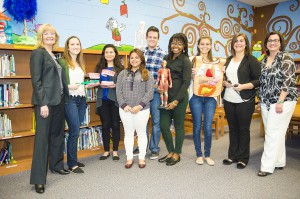 East Campus President Stacey Johnson (left) joins Valencia professor Olga Vazquez (far right) and her student volunteers at Lawton Chiles Elementary.