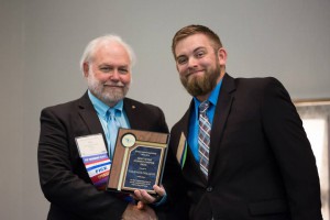 Sean Brooks (right) accepts award for Valencia's chapter of the Florida Engineering Society.