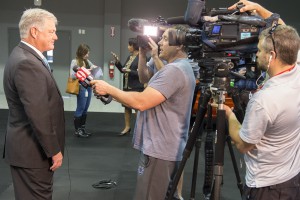 News crews interview Valencia president Dr. Sandy Shugart after the announcement.