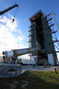 NASA and United Space Alliance workers move an Atlas V rocket into vertical position at Cape Canaveral Air Force Station. (NASA photo.)