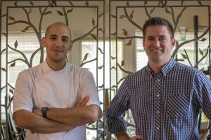 Valencia grads Camilo Velasco (left) and Scott Geisler are behind the helm at 1921.