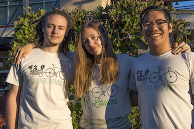 (L to R) Bradley Holcomb, Caroline Chomanics, and Michael Clevenger in front of plant supports at East End Market.